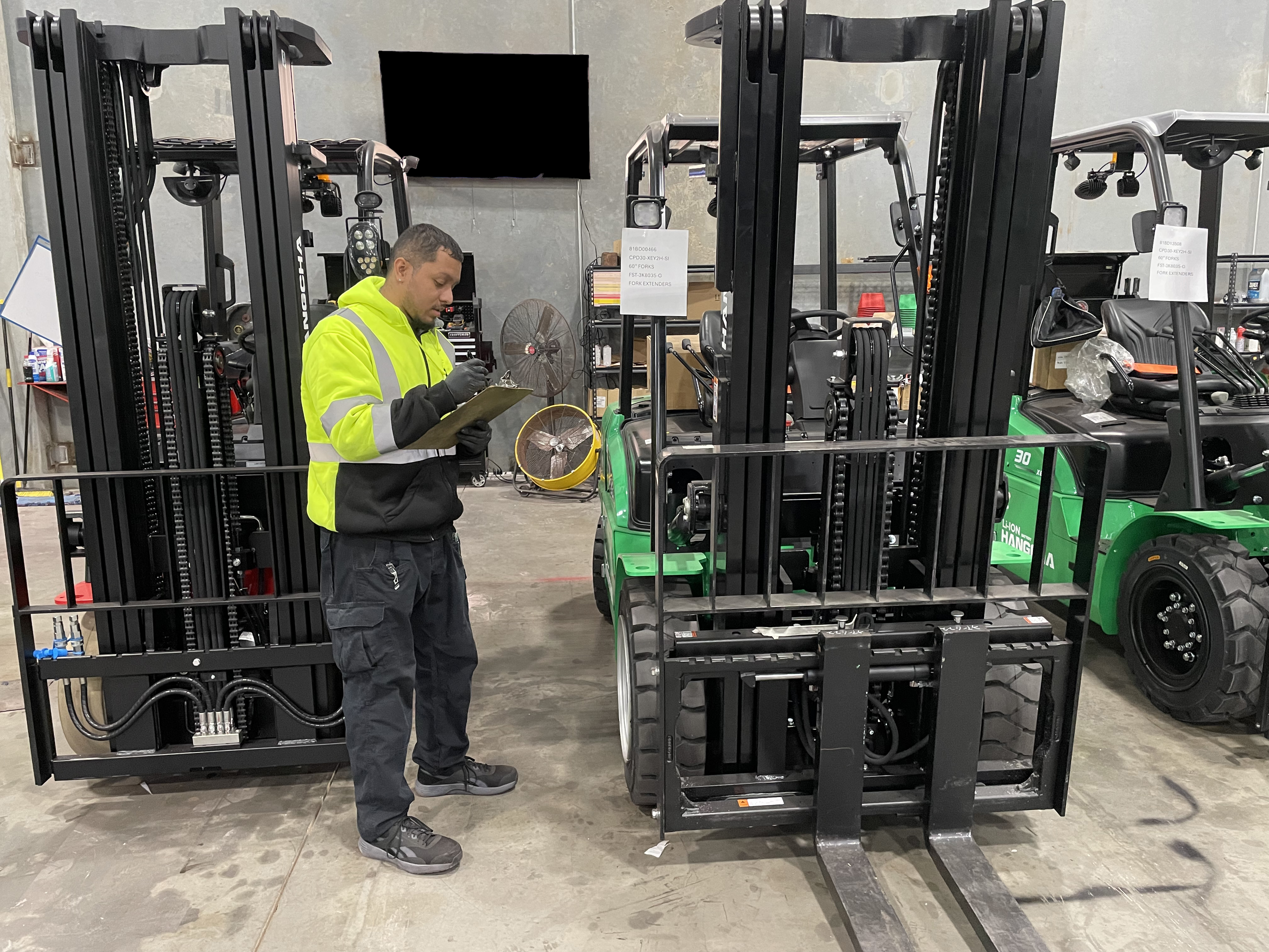 Man conducting a forklift safety check